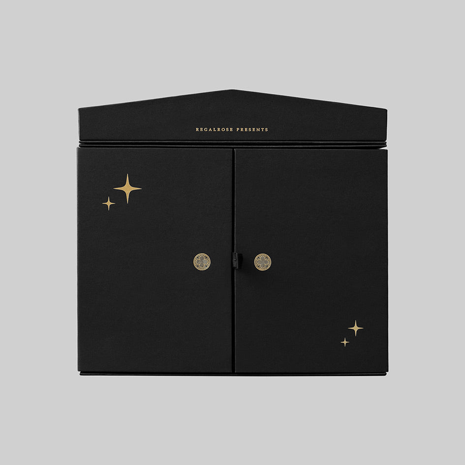 Regalrose 12 Day Jewellery Advent Calendar, black Gothic cathedral box with gold foil stars and double doors, front view
