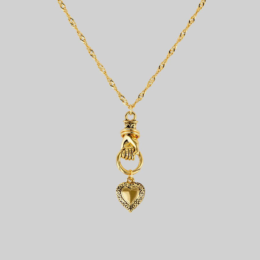 Hand and heart pendant necklace in gold