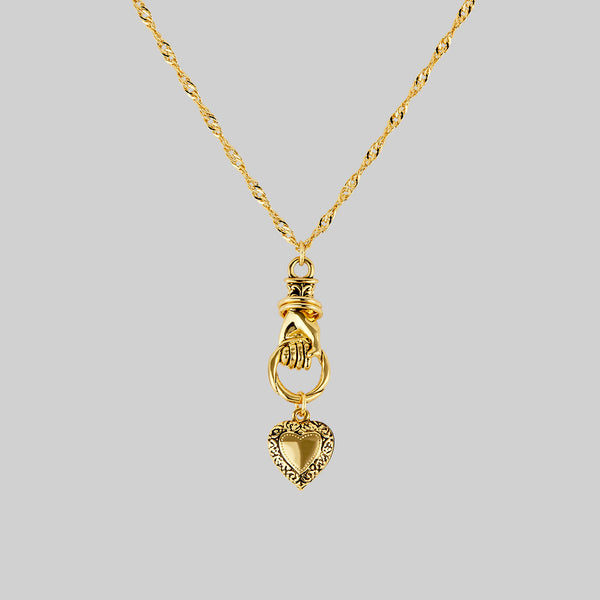ALL OF ME. Hand Grasping Heart Necklace Gold