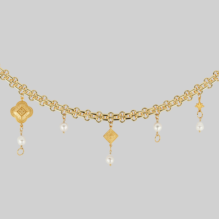 gold charm and pearl necklace