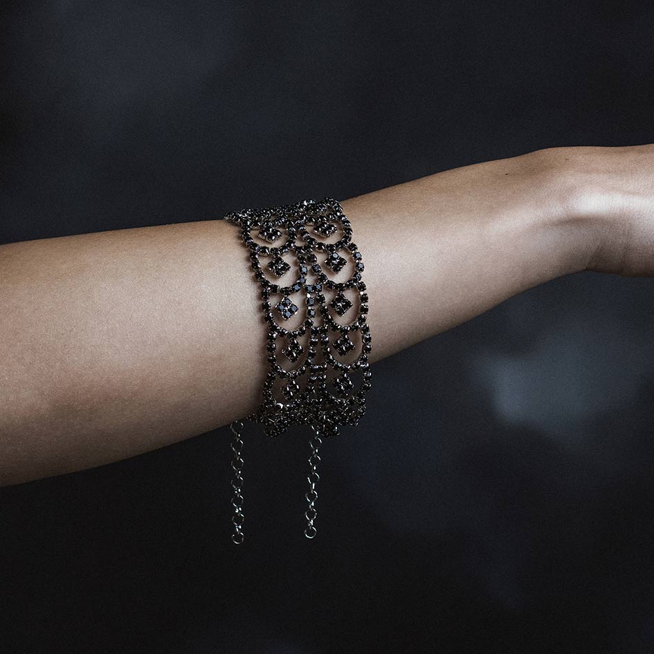 Model wearing Brenna black and silver dazzle chain bracelet on wrist