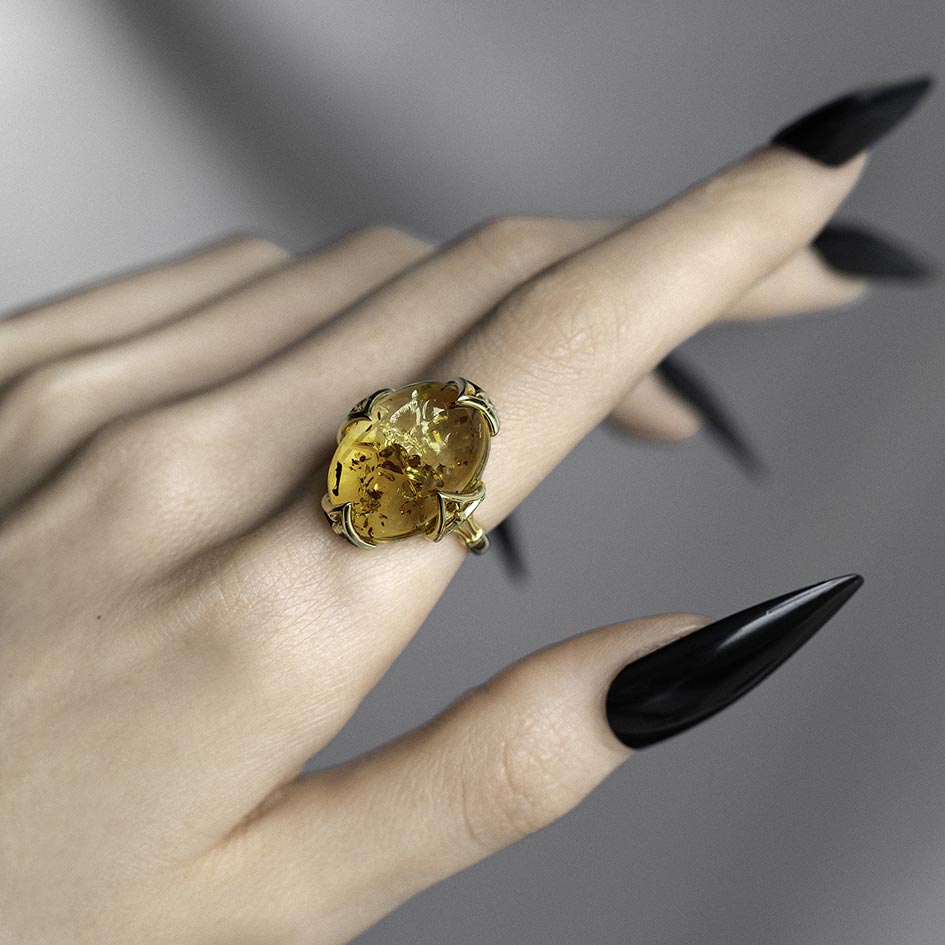 Large Amber cabochon gold ring with Gothic finishes