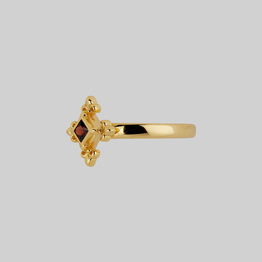CRIMSON. Medieval Fleur de Lis Garnet Ring - Gold gold medieval fleur-de-lis garnet ring