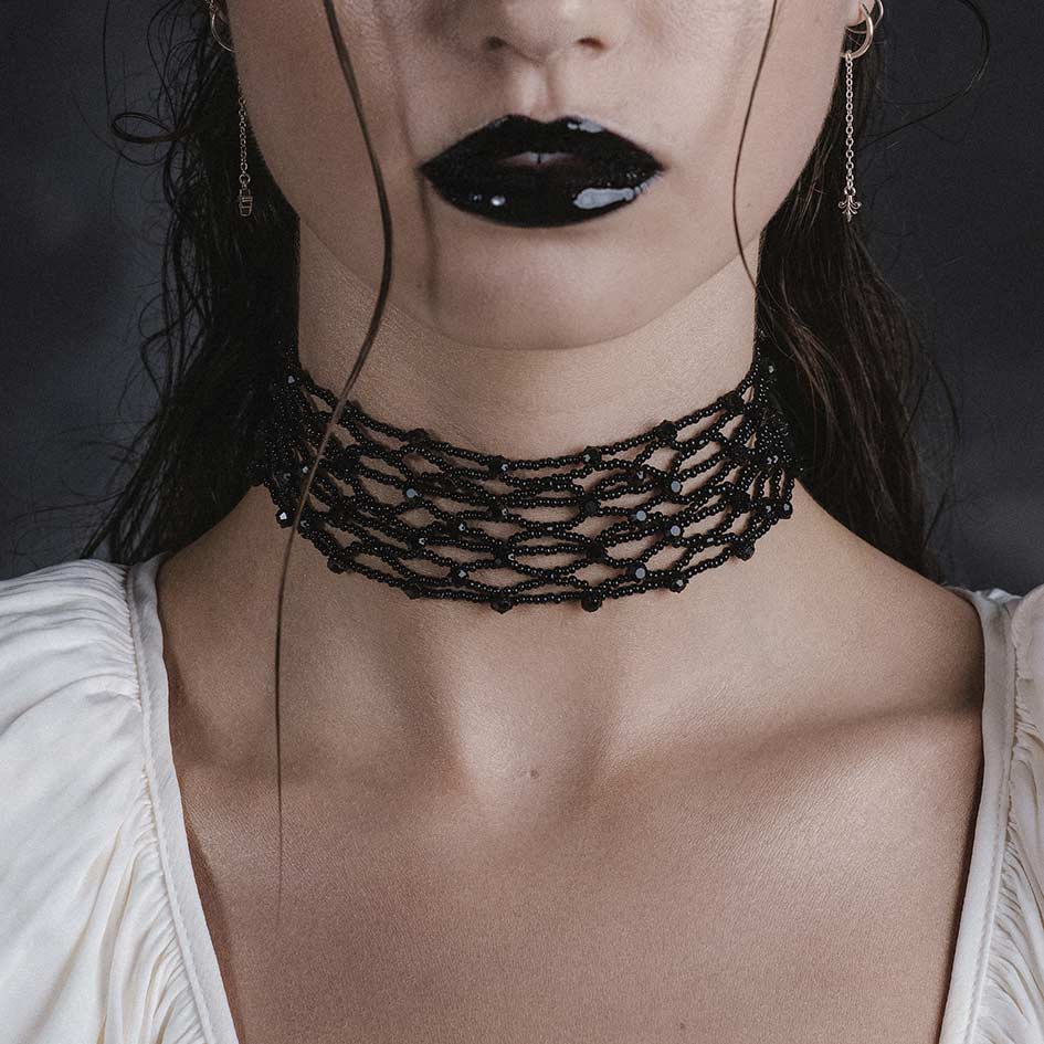 Model wearing Elspeth black wide glass beaded choker