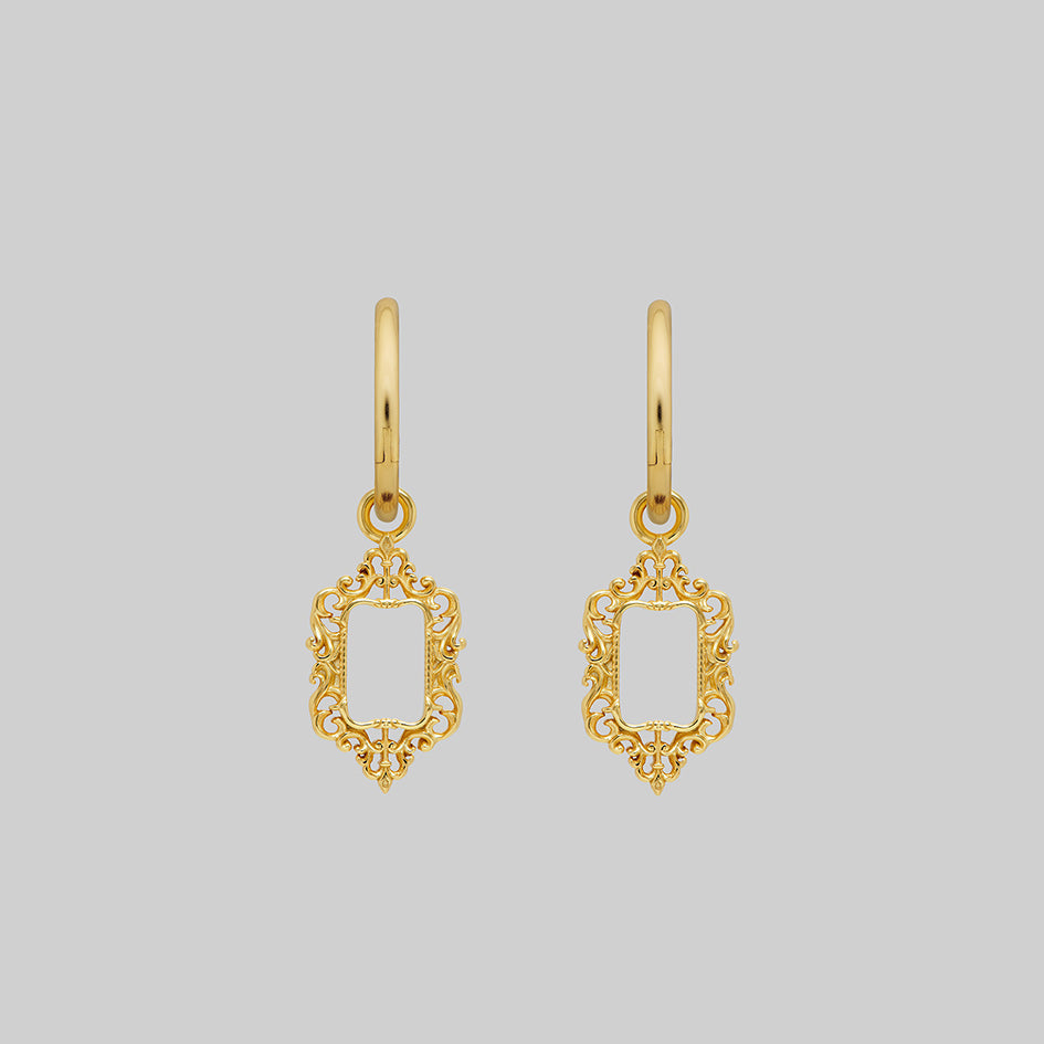 Gold ornate frame hoop earrings, shown as a pair
