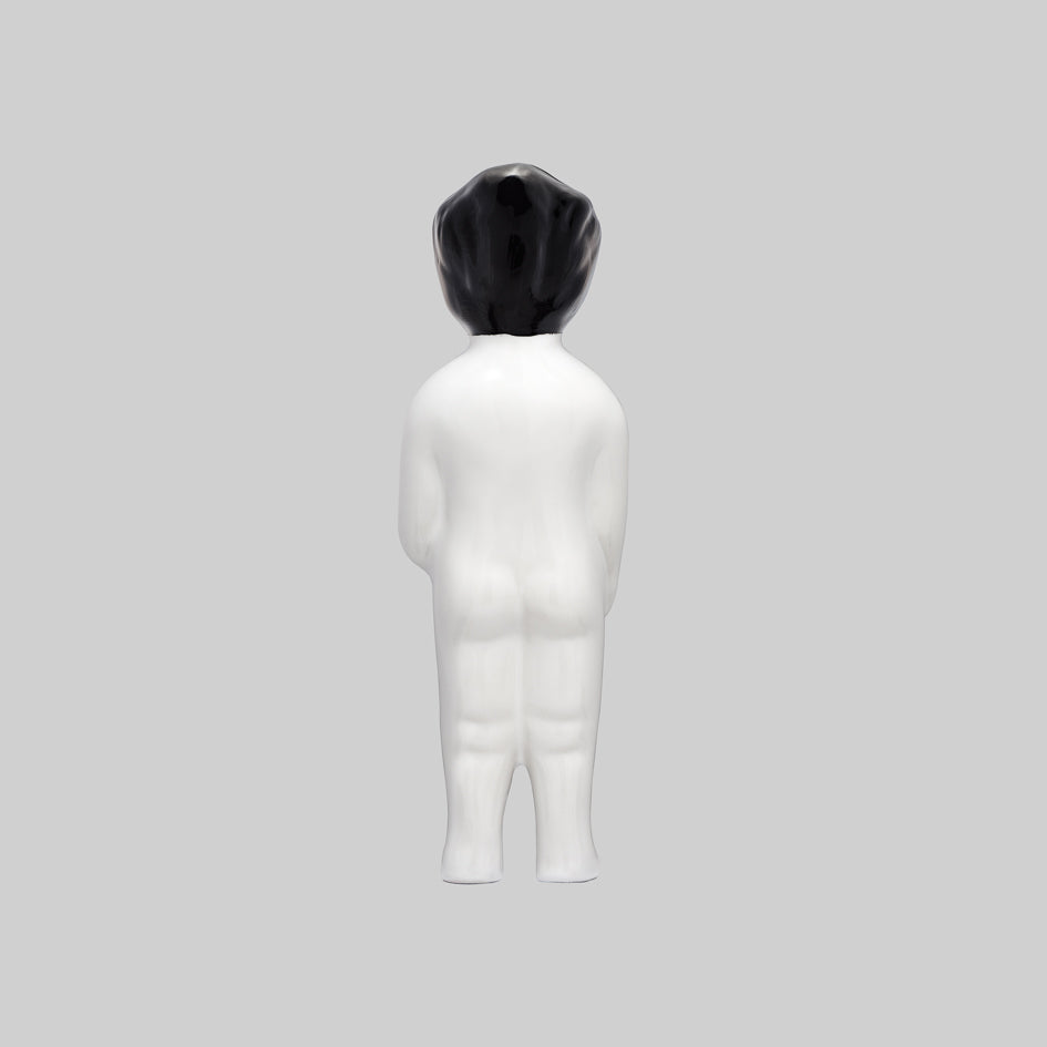 White ceramic figurine, black hair