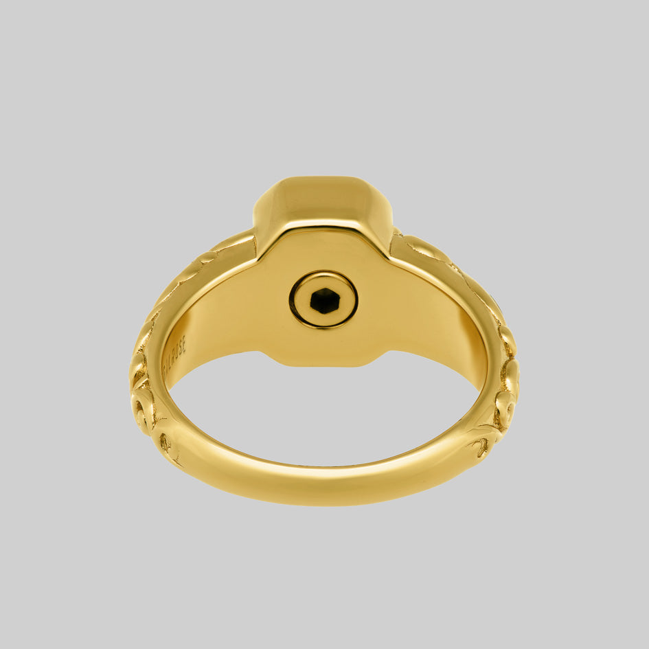 Inside of the gold cremation ring showing the screw fastened ashes chamber beneath the stone