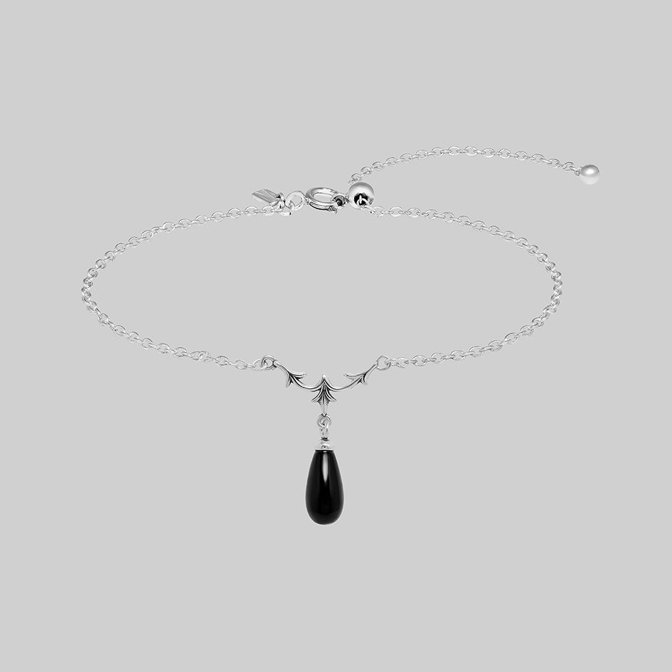 Lisette sterling silver bracelet with heraldic lily and black glass droplet