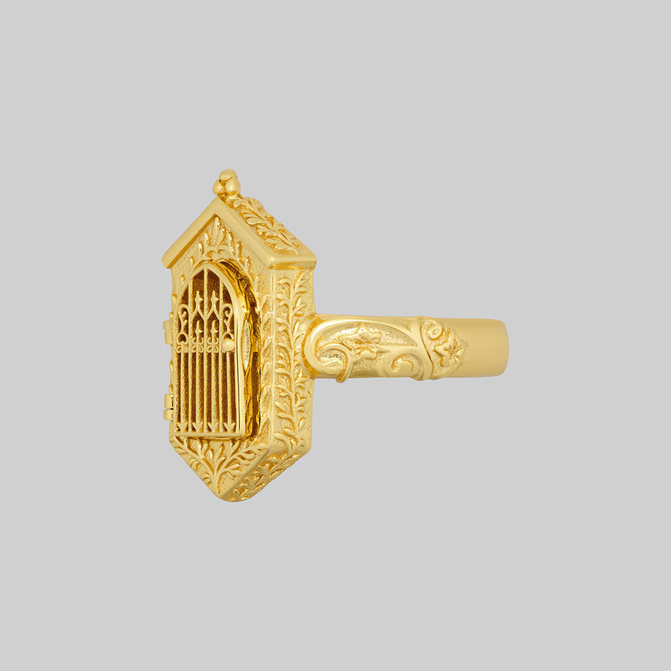 Gold iron gate ring, angled side view