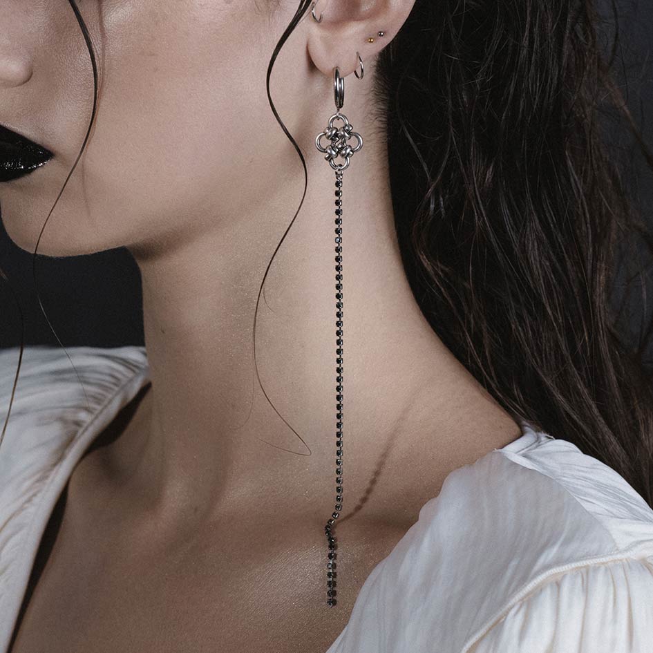 Model wearing Maryse silver chainmail dazzle chain hoop earrings