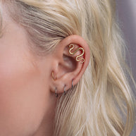 Gold snake piercing
