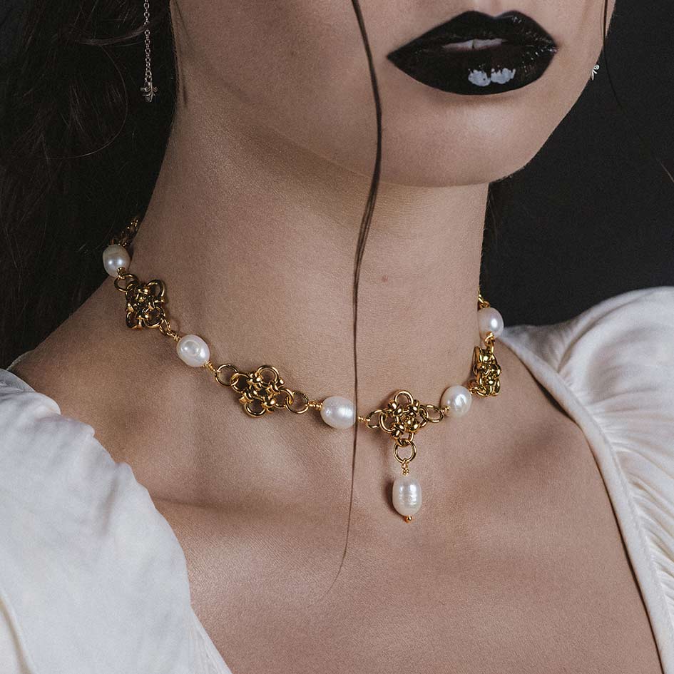 Model wearing Muriel gold chainmail and pearl collar