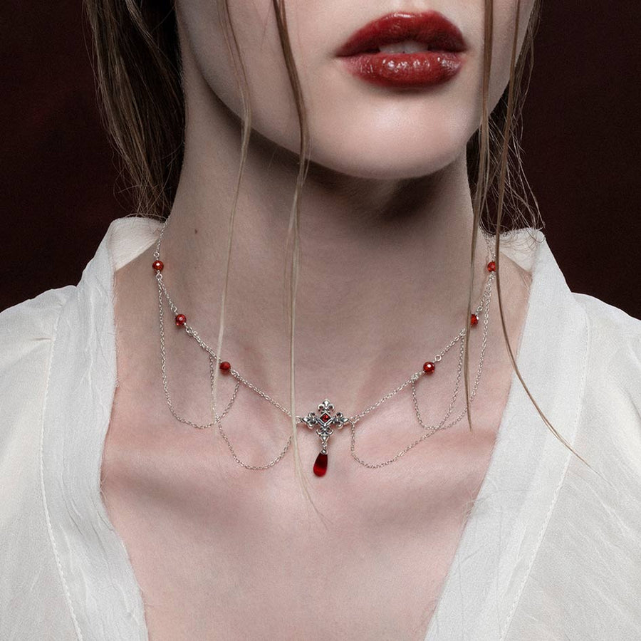 MUTINY. Fleur de Lis Multi-Drop Garnet Collar - Silver silver draped necklace with garnets and fleur de lis