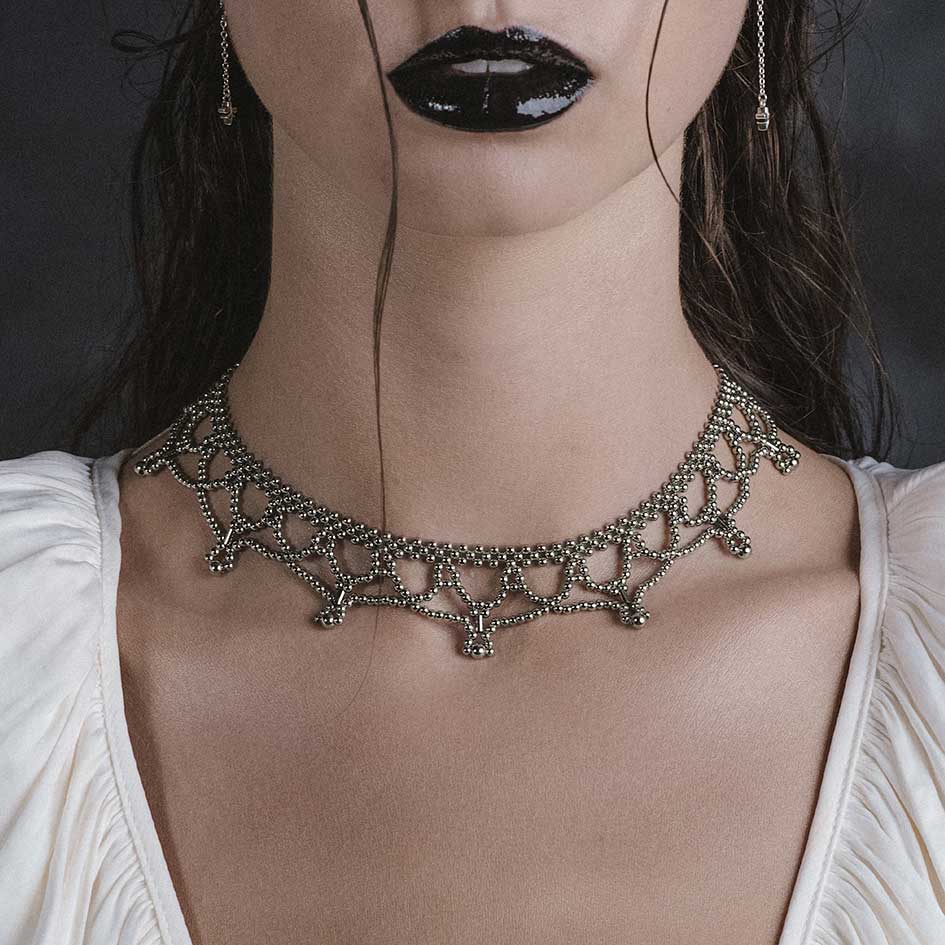 Model wearing Ninette silver tracery metal beaded collar