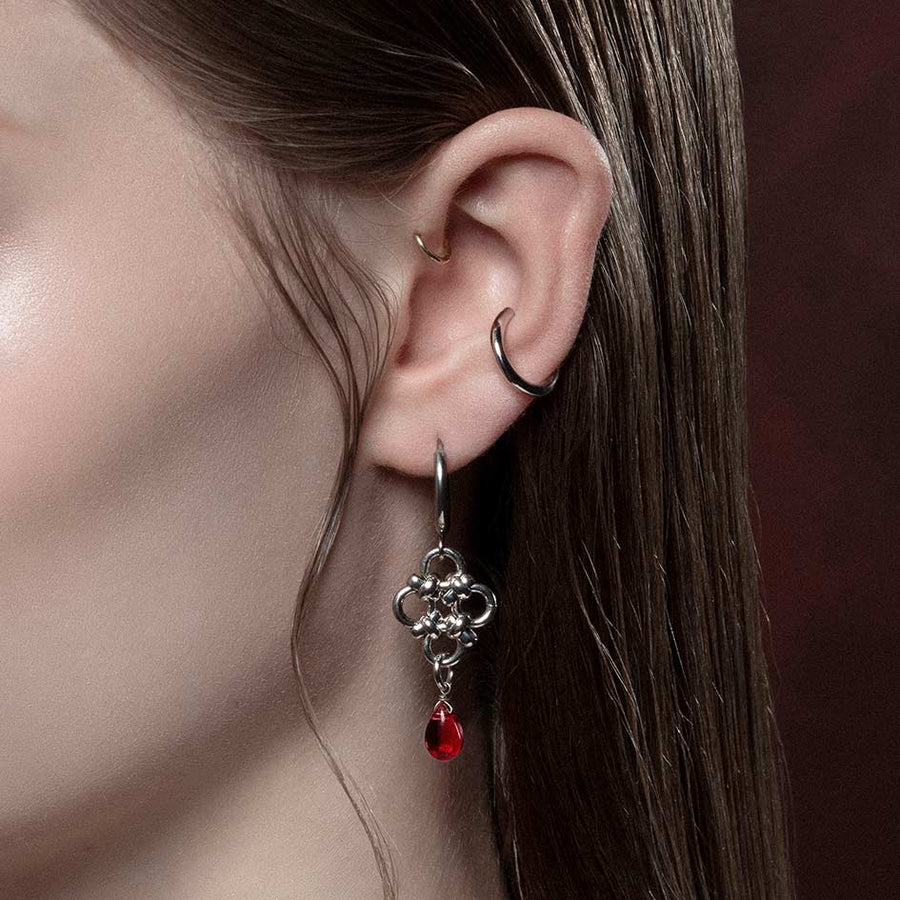 RUBIOUS. Chainmail & Red Glass Hoop Earrings - Silver Silver knotted dangle earrings with red droplet