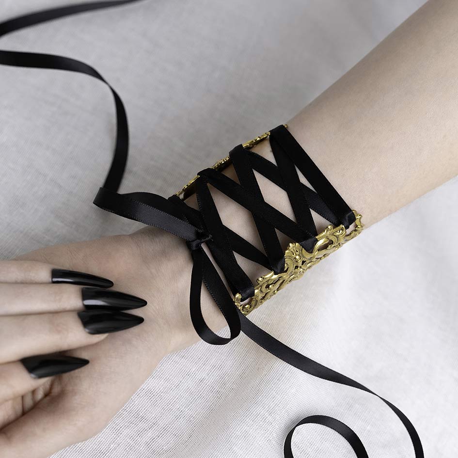 Decorative gothic corset cuff bracelet intricate design black lace straps