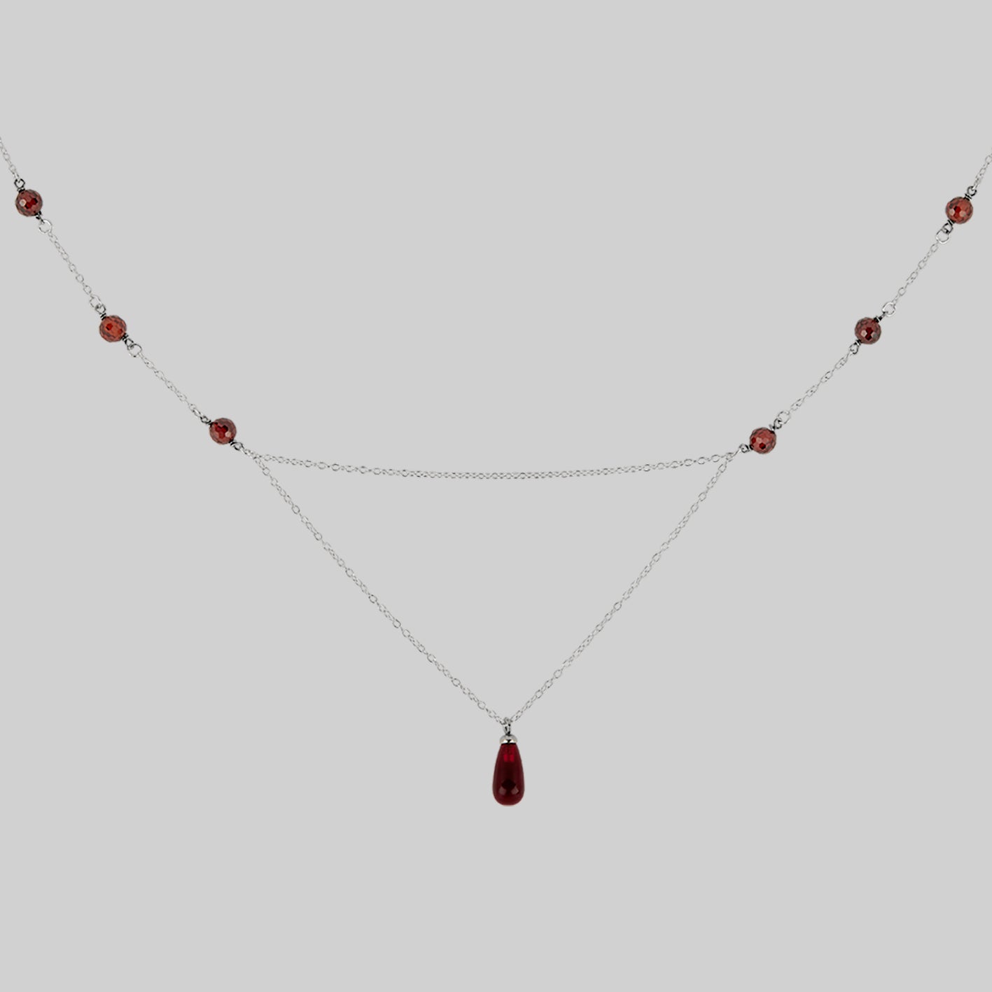 silver chain necklace with red drop and beads