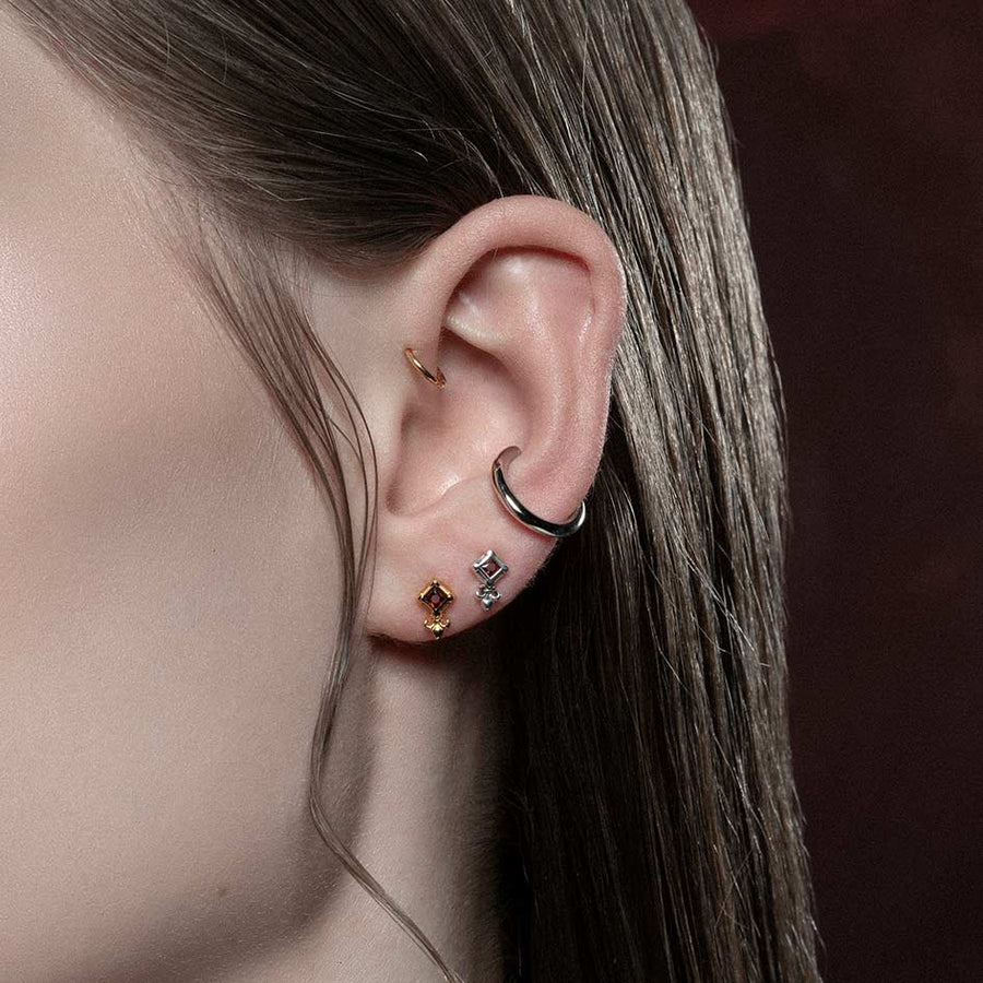 SCORN. Tiny Garnet Stud Earrings - Silver silver tiny fleur-de-lis garnet stud earrings
