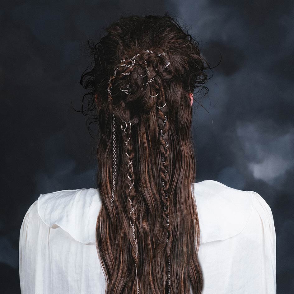 Model wearing Siege silver chain hair rings