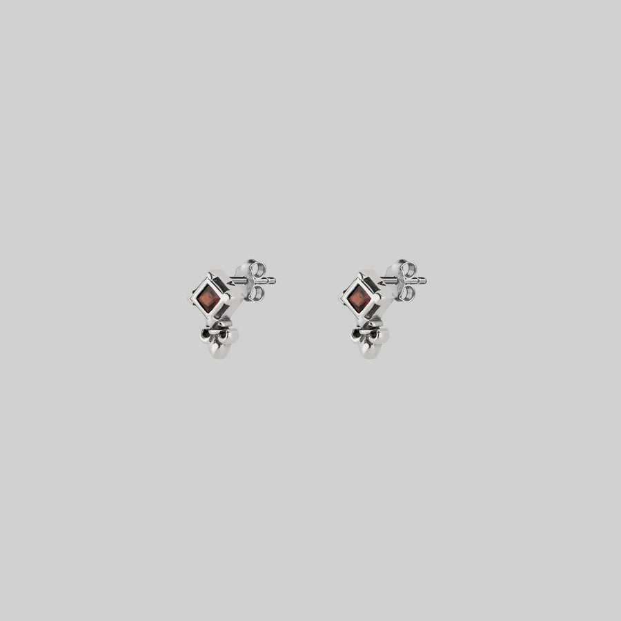 SCORN. Tiny Garnet Stud Earrings - Silver silver tiny fleur-de-lis garnet stud earrings
