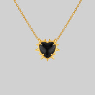 gold heart necklace with spikes