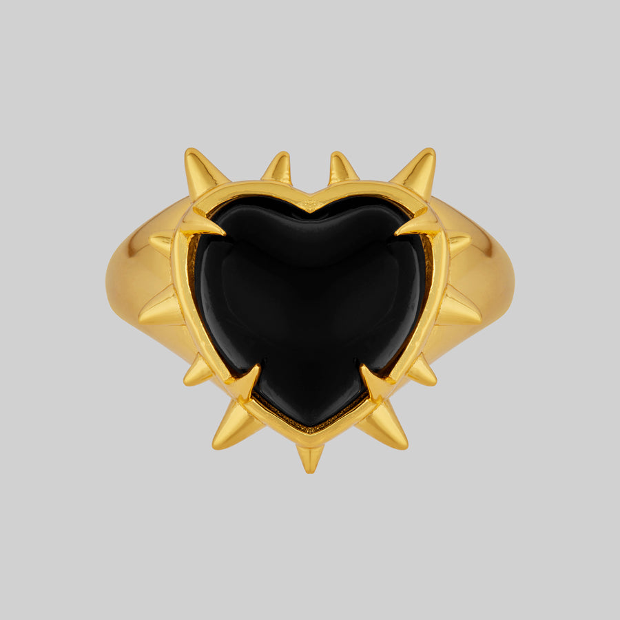 gold spike ring with black heart