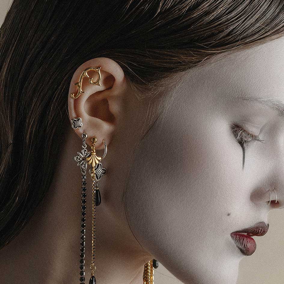 gold and silver gothic jewellery stacked