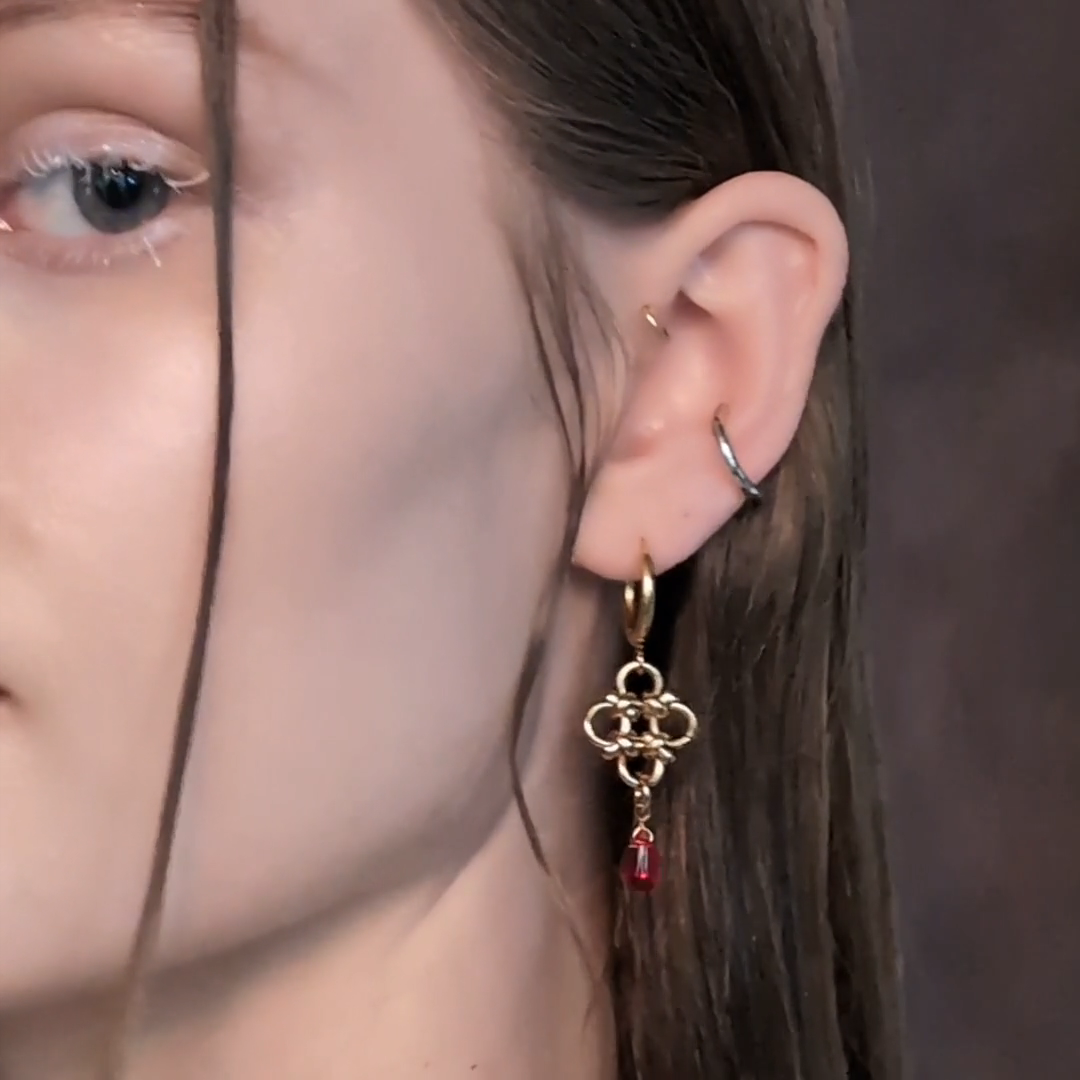 gold chainmail drop earrings with knots and red drop