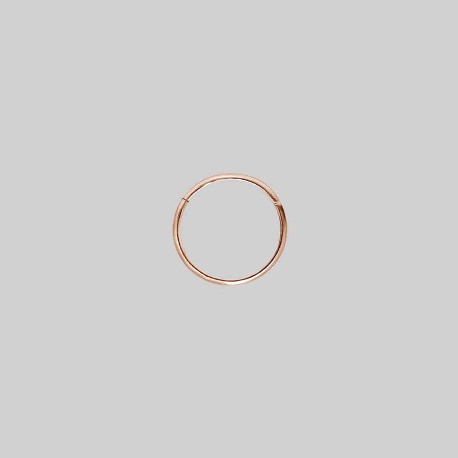 SASHA. Rose Gold Titanium Clicker Ring A simple rose gold clicker ring 10mm x 0.8mm