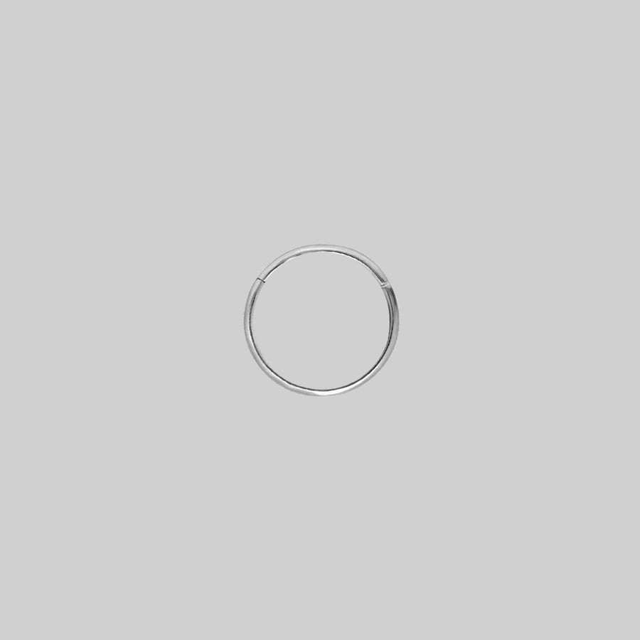 MIA. Silver Titanium Clicker Ring A simple, seamless silver clicker piercing 10mm x 0.8mm