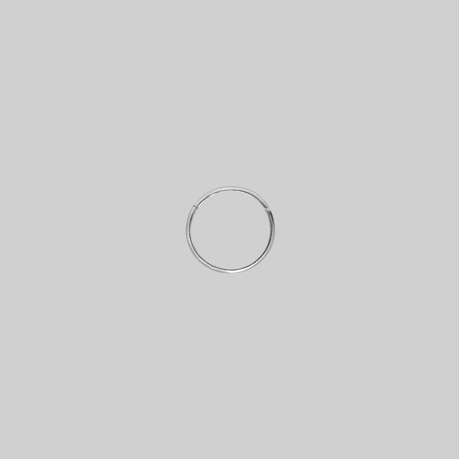 MIA. Silver Titanium Clicker Ring A simple, seamless silver clicker piercing 6mm x 0.8mm