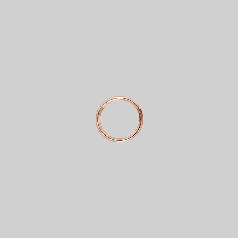 SASHA. Rose Gold Titanium Clicker Ring A simple rose gold clicker ring 6mm x 1.2mm