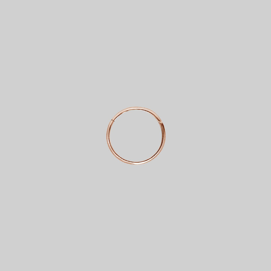 SASHA. Rose Gold Titanium Clicker Ring A simple rose gold clicker ring 8mm x 0.8mm