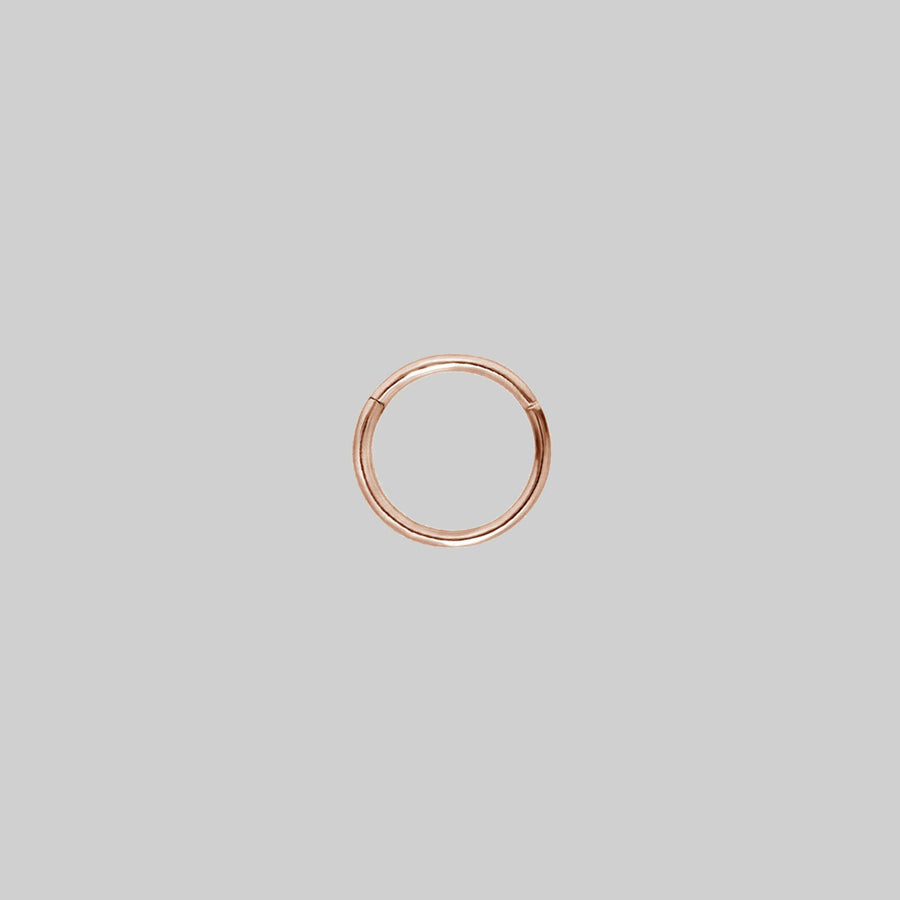 SASHA. Rose Gold Titanium Clicker Ring A simple rose gold clicker ring 8mm x 1.2mm
