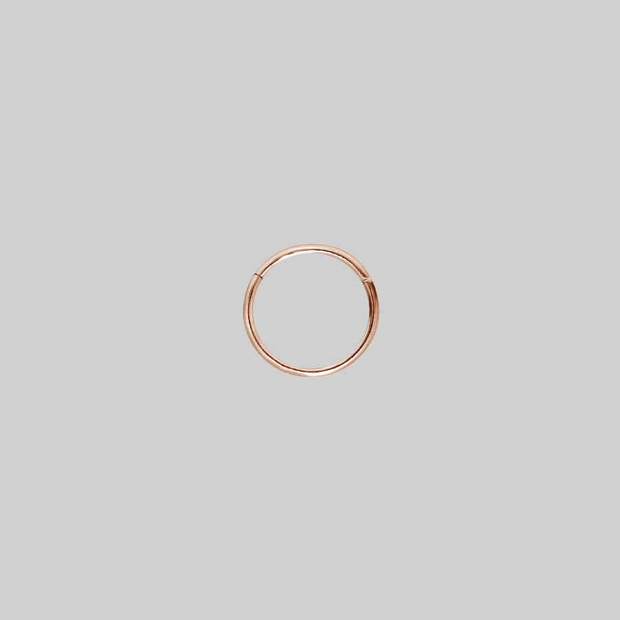 SASHA. Rose Gold Titanium Clicker Ring A simple rose gold clicker ring 8mm x 1mm