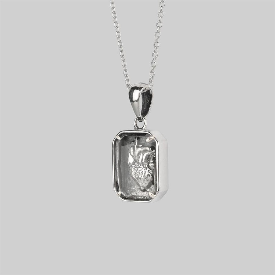 HEART KEEPER. Anatomical Heart Under Glass Necklace - Silver Sterling silver square 3D anatomical heart under glass necklace side profile