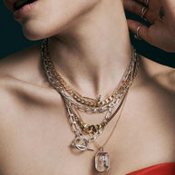 gold interlocking hands necklace