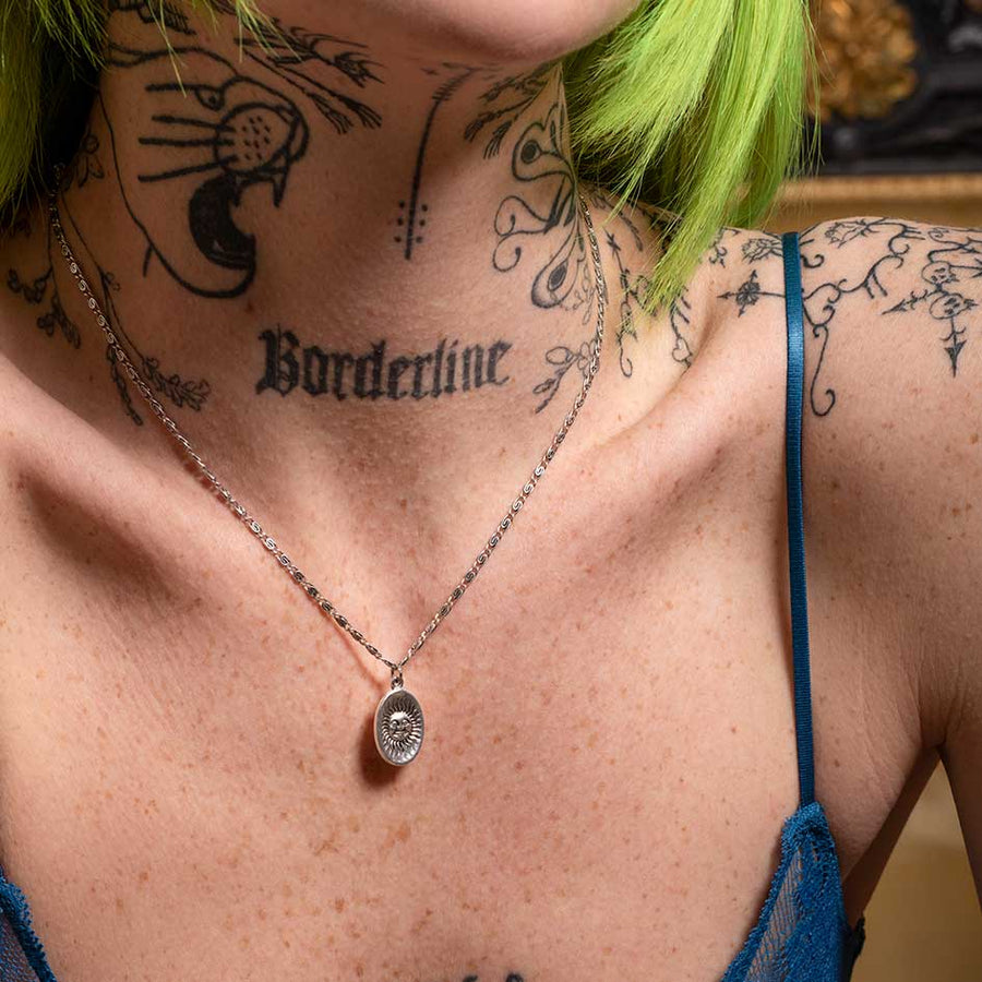 DAWN. Symbolic Sun Face Necklace - Silver silver medallion sun necklace