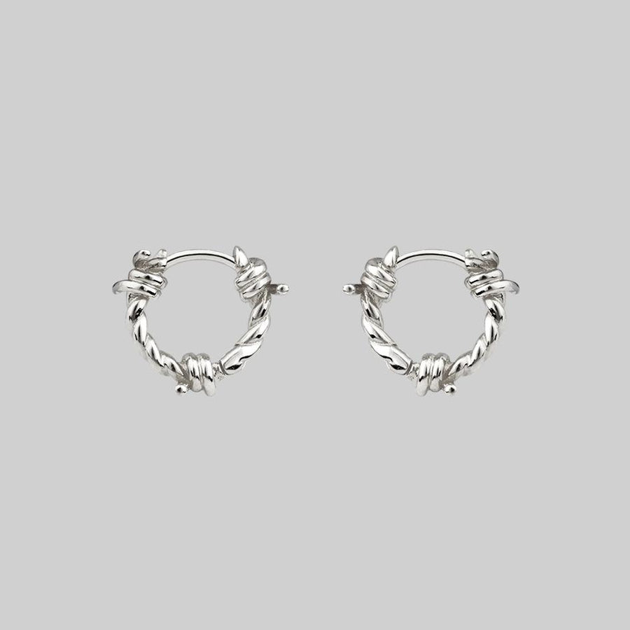 SURVIVAL. Symbolic Barbed Wire Clicker Hoop Earrings - Silver