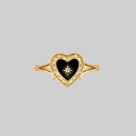 gold ring with black heart 