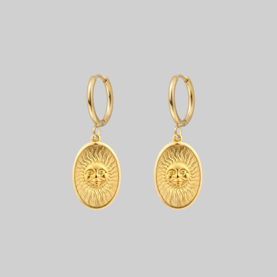 gold sun face charm hoop earrings