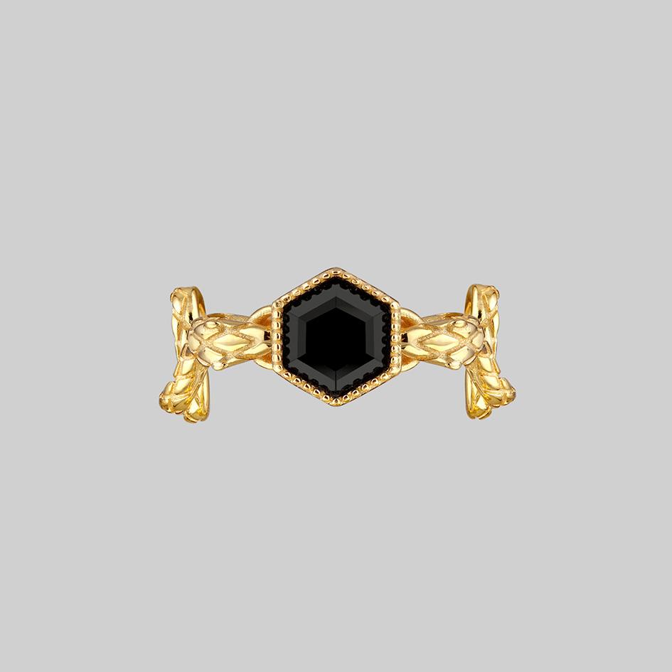 black gemstone and snake ring