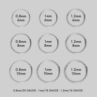 group picture of silver clicker rings and their sizing