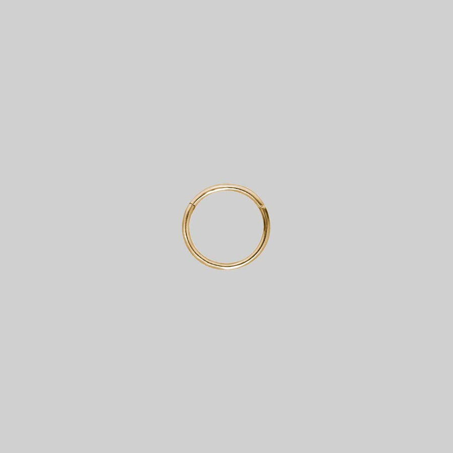 TUTSI EXTRA MINI. Gold Titanium Septum Clicker Ring A small gold clicker ring with a simple design