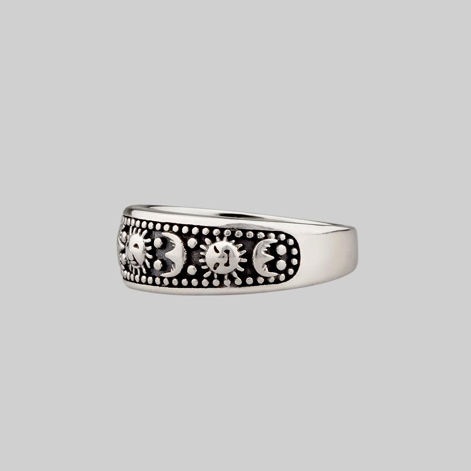 thick silver band ring with sun and moon