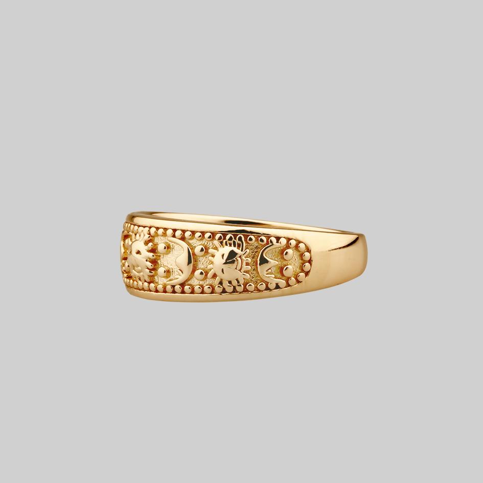 thick gold band ring with sun and moon