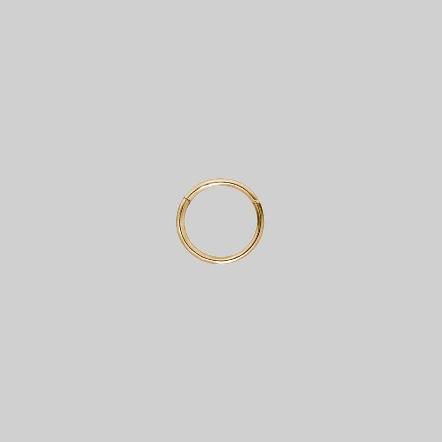 TUTSI EXTRA MINI. Gold Titanium Septum Clicker Ring A small gold clicker ring with a simple design