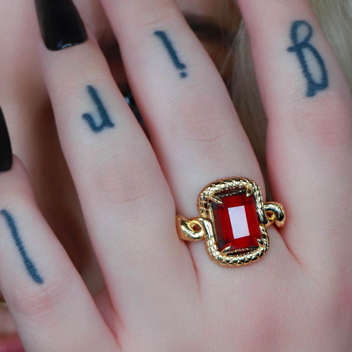 gold garnet snake ring