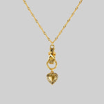 Hand and heart pendant necklace in gold