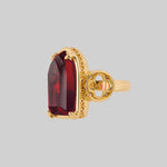 gothic cathedral arch red glass window gold ring